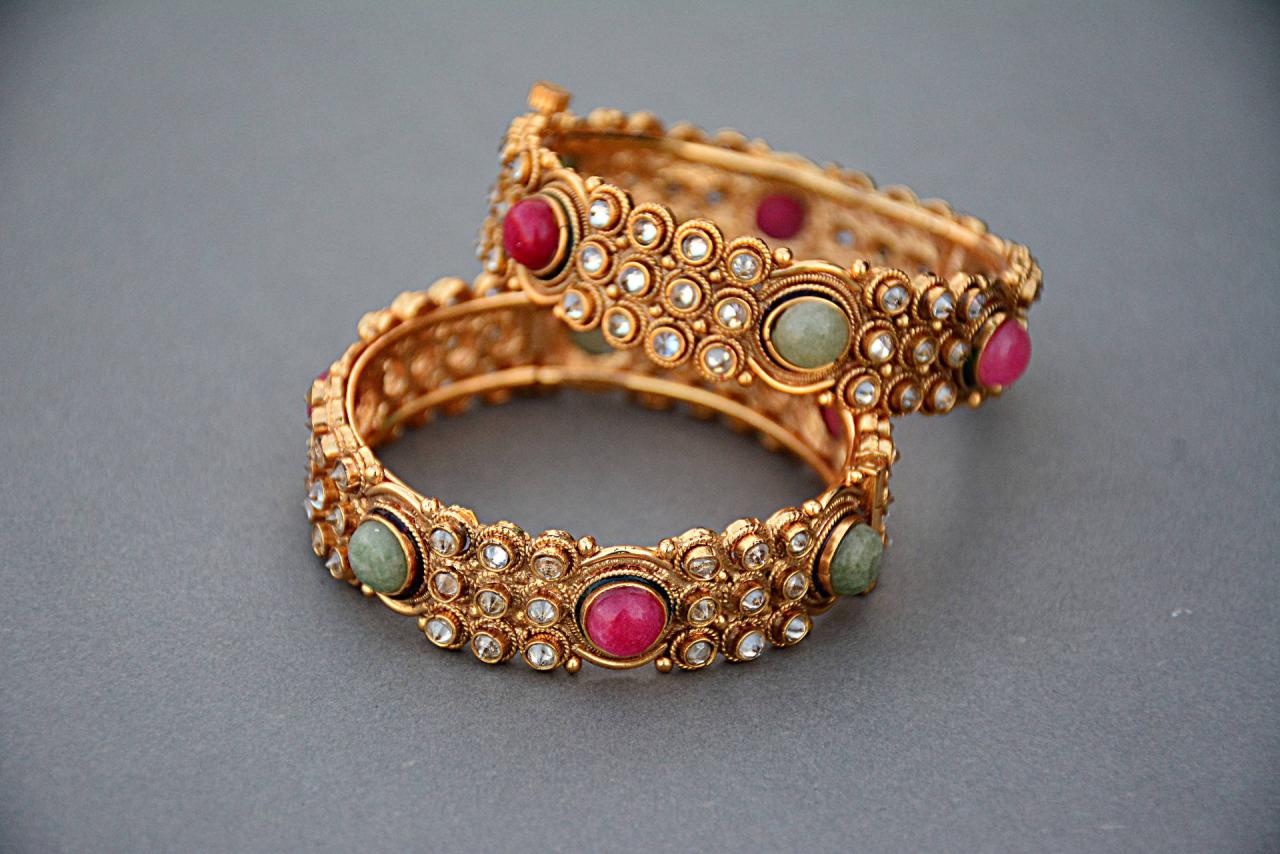 Download Gold Jewellery With Red Stones Wallpaper | Wallpapers.com